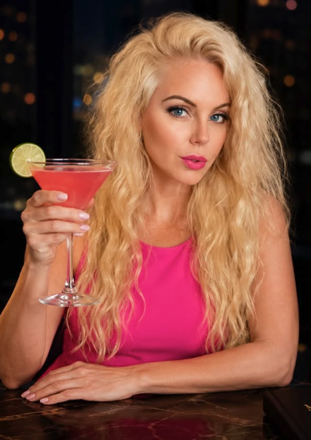 Erin Ashley holding a pink martini